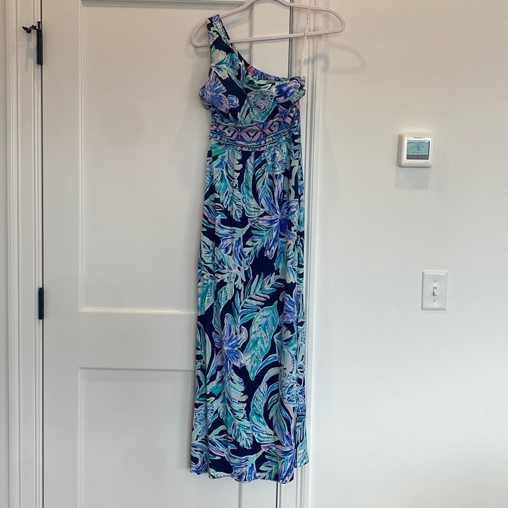 Never worn.  One shoulder long dress.  Padding in chest